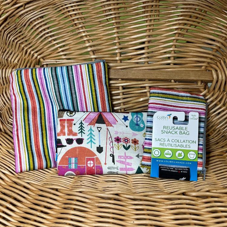 The contents of the Spring 2024 Glamping Box: Colibri Canada reusable snack bags in three sizes