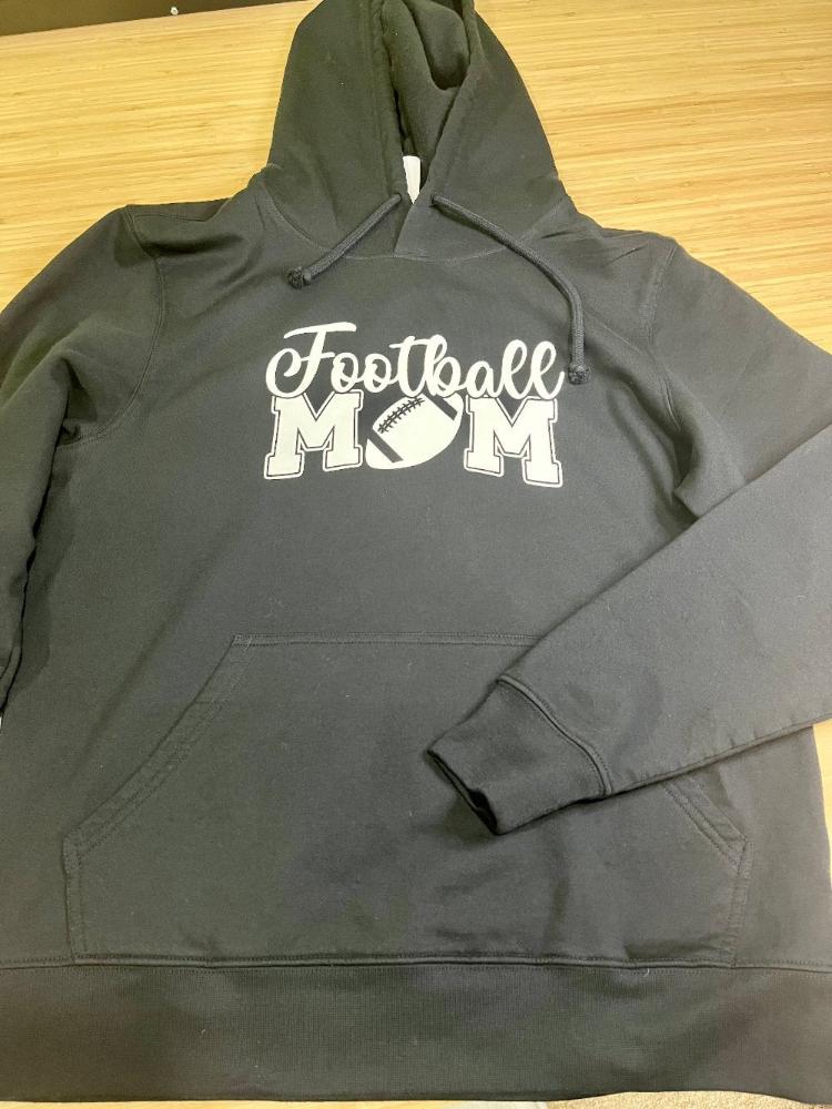 Black hoodie with "Football mom" on the front