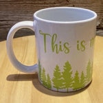 Load image into Gallery viewer, Our white &quot;This is my cottage / camping mug&quot; 12oz mug.  White mug with green lettering that says &quot;This is my&quot; over a green forest.  The rest of the mug would say &quot;camping mug&quot; or &quot;cottage mug&quot; depending on which you choose.  Very cute for camping or the cottage.
