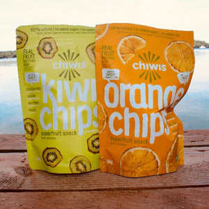 Pictured here are two bags of Chiwis nature fruit snack chips!  One bag is green and had kiwi chips, the other is orange and has orange chips.  They were part of the July Glamping Box.