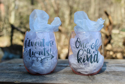 These impact resistant plastic wine tumblers are durable enough to be taken on the go, but glamorous enough to stay home (or at the cottage)!  Available in pink or clear, with the sayings "One of a Kind" or "Adventure Awaits", we say ... get both!