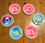 Load image into Gallery viewer, Round ceramic coasters, 100% customizable. Comes as a set of two!  Perfect for the trailer, camper, RV, cottage, tent or whatever your glamping adventures take you!    Some customers love them so much they use them at home to keep that glampy feeling year-round. Makes a great gift!  

