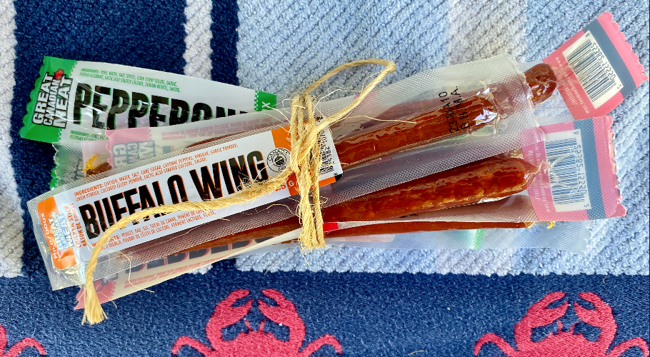 From the June Glamping Box: a package of pepperoni sticks wrapped with twine.  Buffalo Wing, Spicy Buffalo Wing, Mild and Spicy Original Pepperoni - great campfire snack.