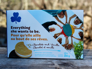 From the May Glamping Box, this is a picture of a box of chocolate and vanilla Girl Guide cookies.  "Everything she wants to be."
