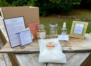 Our August Glamping Box in its entirety! Info card, recipe card, Old Fashioned cocktail, solar lantern, s'mores kit, lavender room spray and pine & soy fire starters. Everything Canadian and everything perfect for a late-summer glamping adventure (camping OR cottage).