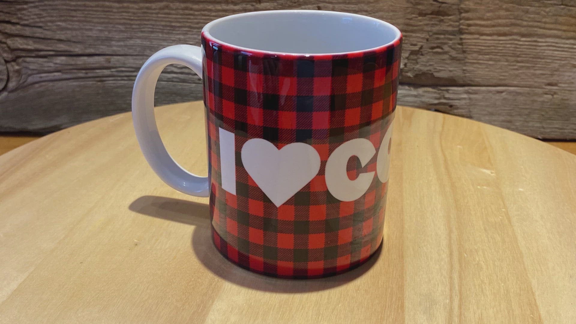 A quick video of our 'I Heart Coffee' ceramic 12 oz Glampy mug.  It is spinning slowly so that the words "I Heart Coffee" can be read.  The words are printed in white on a buffalo check (red and black) background.