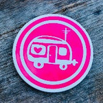 Load image into Gallery viewer, Round ceramic coasters, 100% customizable. This on is bright pink with an icon of a small RV in a white circle.
